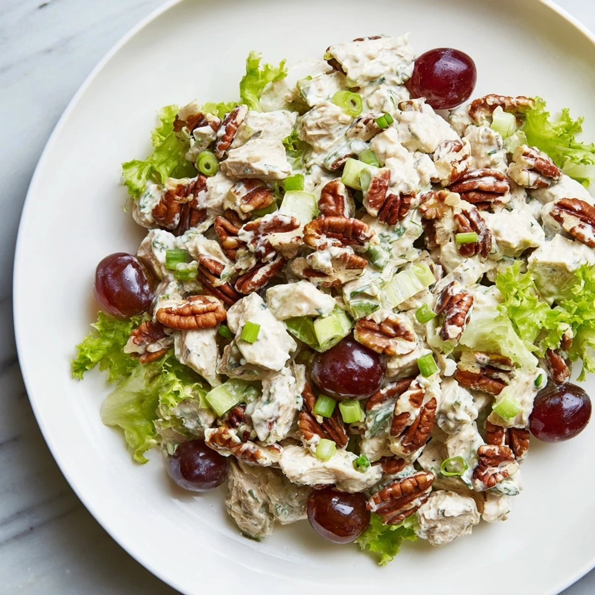 Tender diced chicken and toasted pecans mixed with creamy dressing, green onions, and bright lemon for a satisfying lunch.