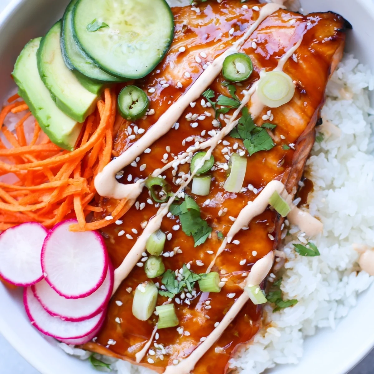 A vibrant bowl of Teriyaki Salmon Rice Taco Bowls with Pickled Veggies features flaky salmon and crunchy vegetables.
