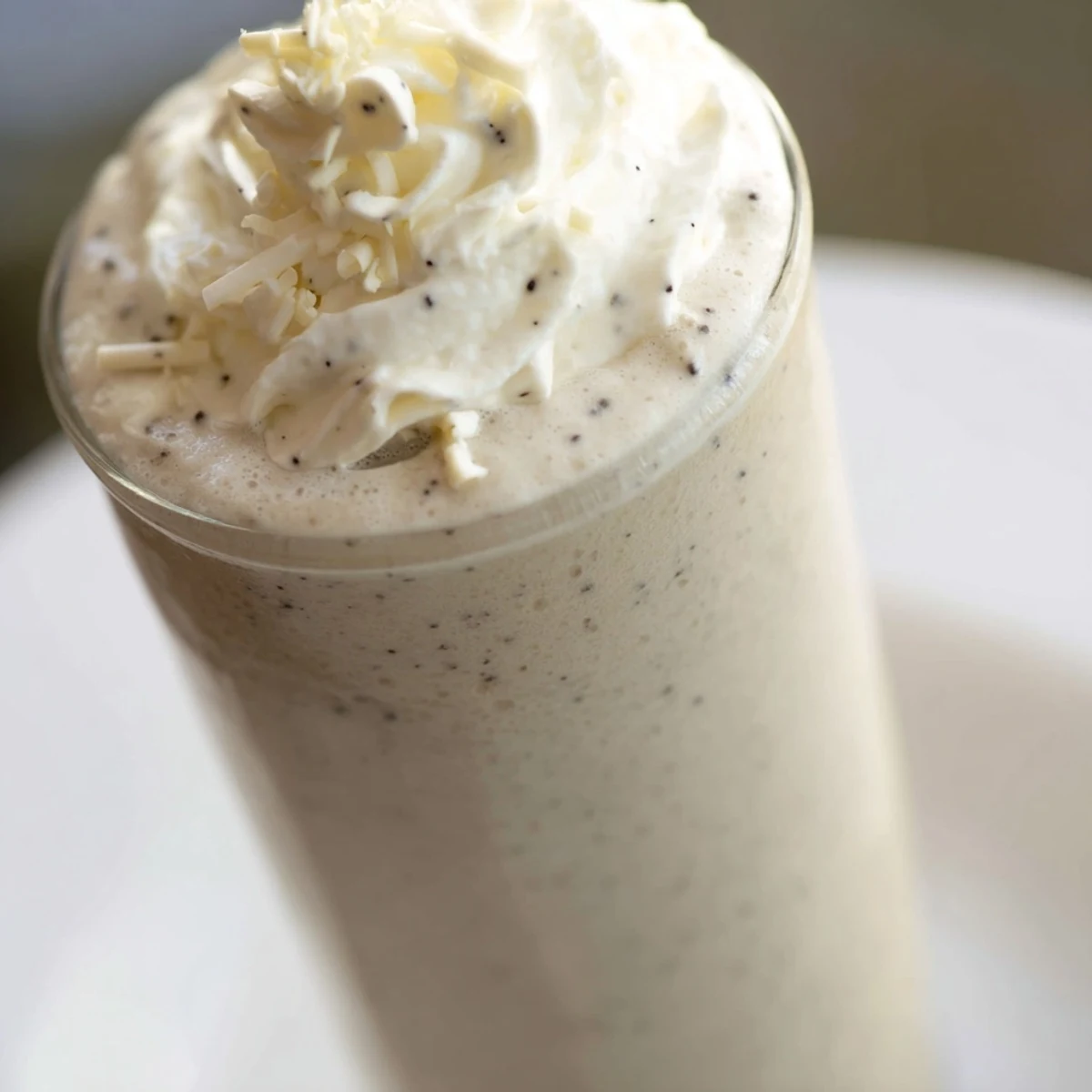 Cold Vanilla Bean Frappuccino served with a straw, perfect for a refreshing afternoon sip.