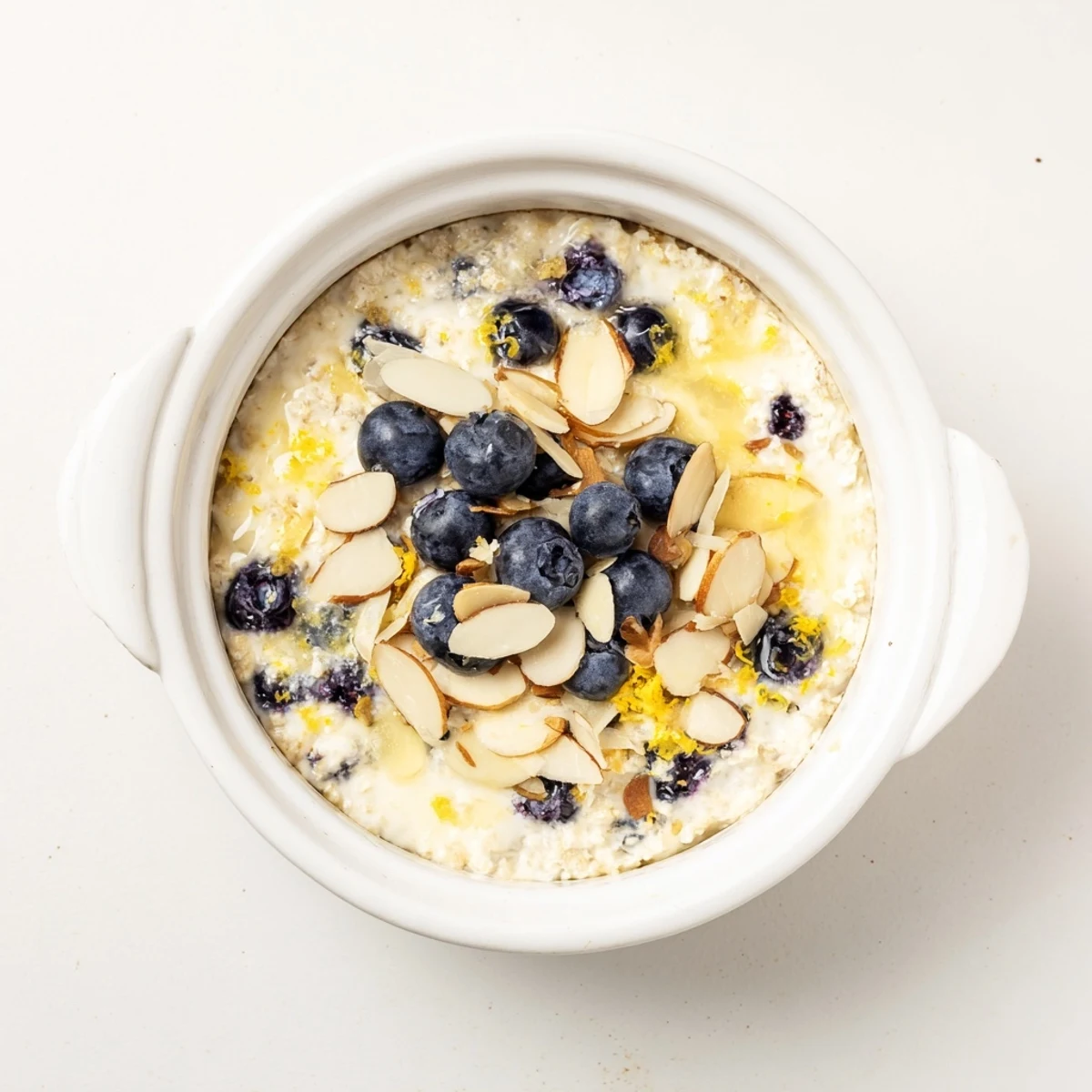 Golden Baked Blueberry Cottage Cheese Breakfast Bowls served warm from the oven with fresh berries.