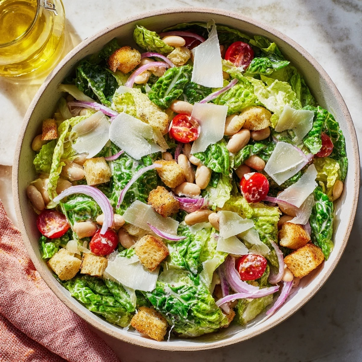 Fresh butter bean Caesar salad with crisp romaine, creamy dressing, and golden croutons