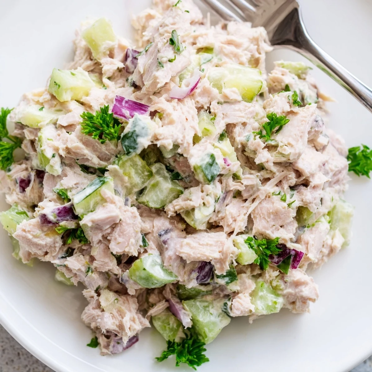 Homemade tuna salad lettuce wraps topped with cherry tomatoes for a healthy low-carb lunch