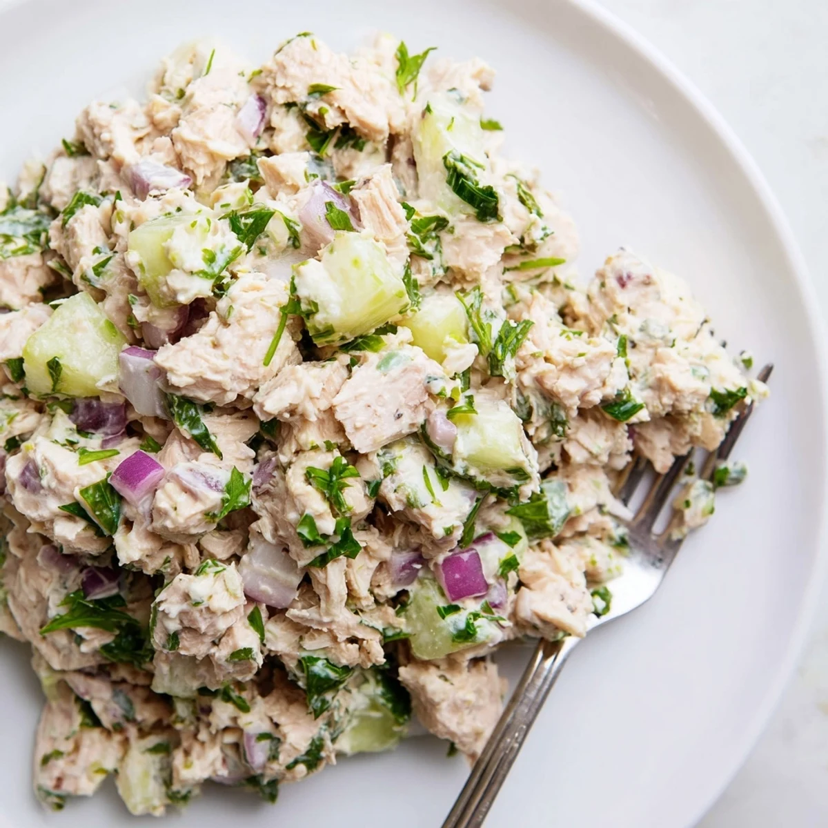 Protein-rich tuna salad wrapped in butter lettuce leaves with crisp vegetables and bright garnish