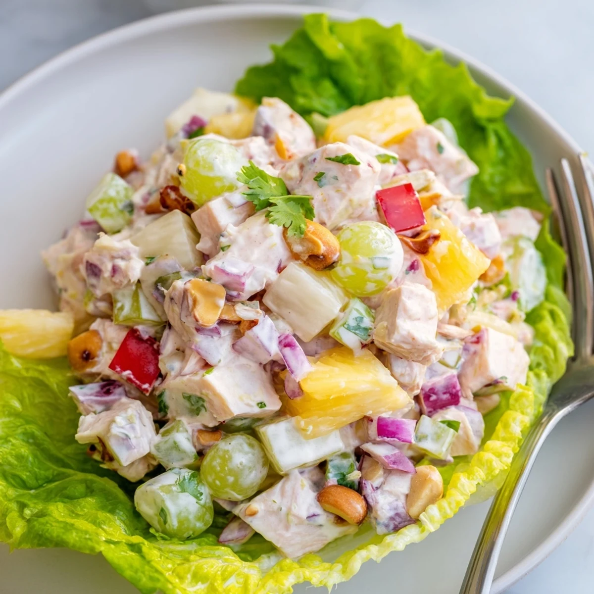 Bright Hawaiian Chicken Salad Recipe tossed with crisp celery, grapes, toasted macadamias