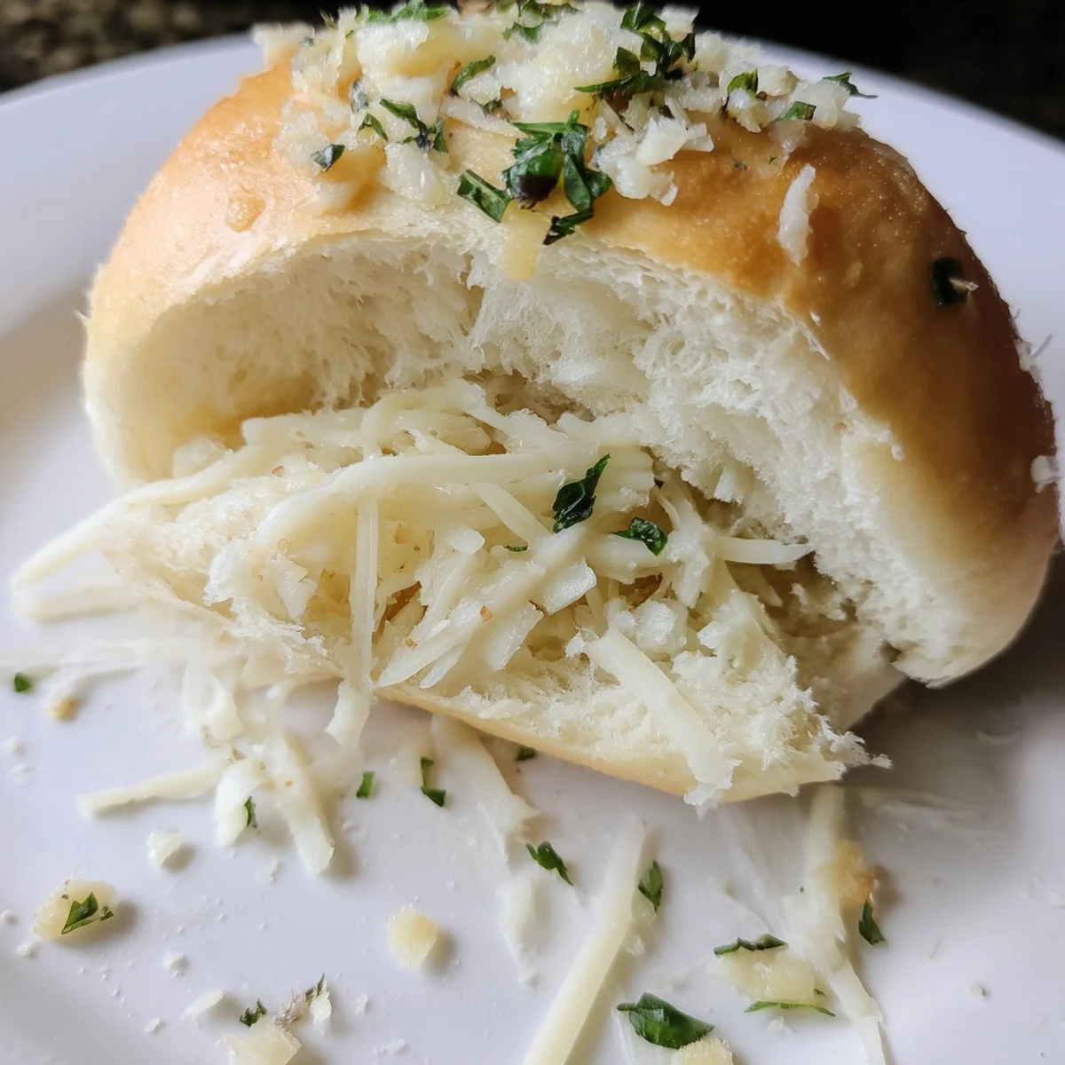 Freshly baked Buttery Cheese Garlic Rolls brushed with garlic butter, parsley