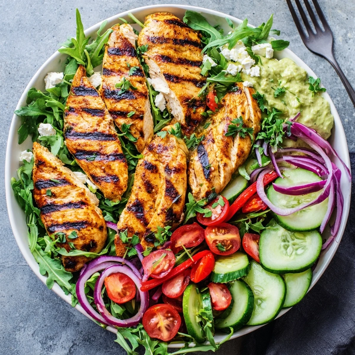 Grilled Chicken Salad with creamy avocado herb dressing, sliced smoky chicken resting