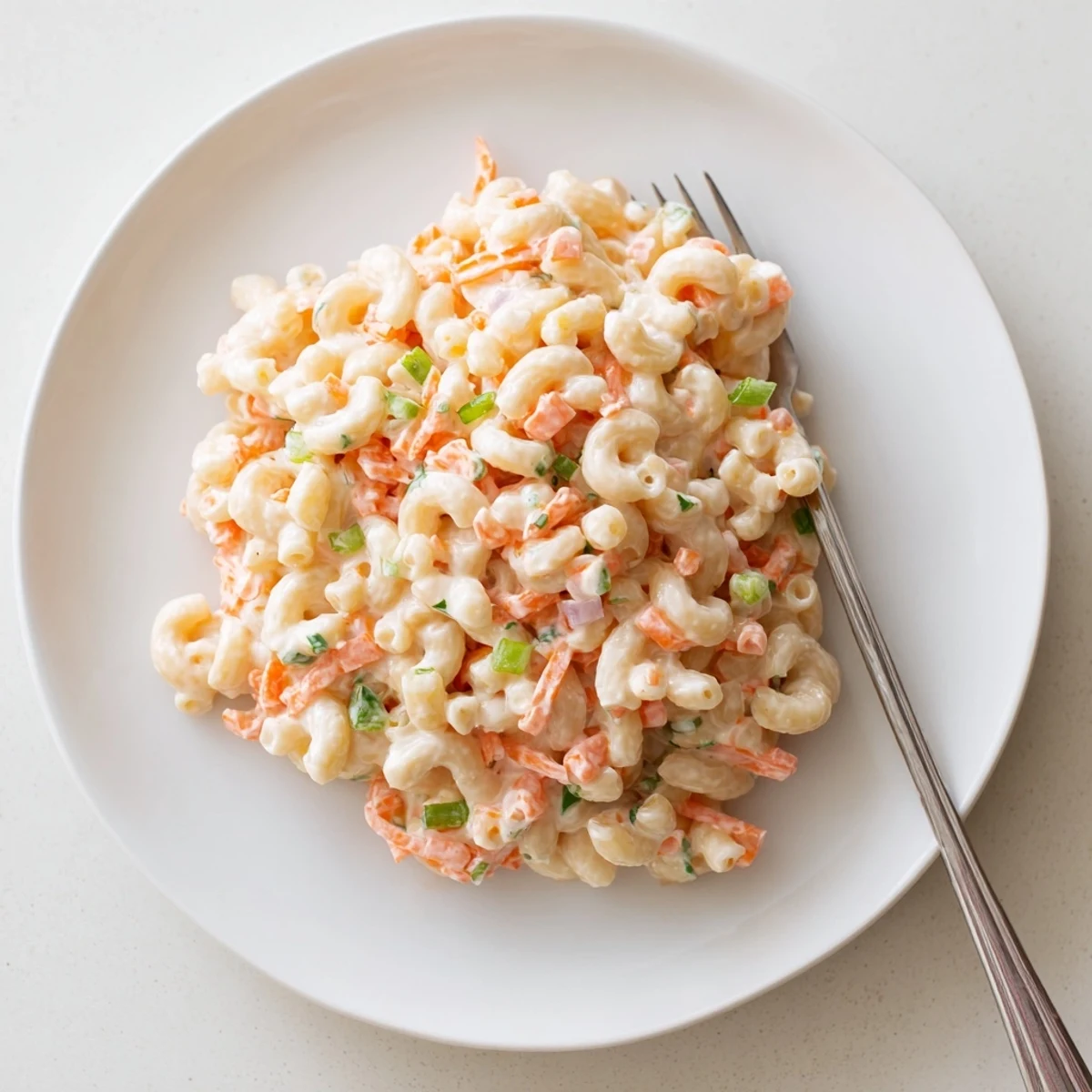 Hawaiian style mac salad featuring tender elbow macaroni tossed in a tangy mayonnaise dressing