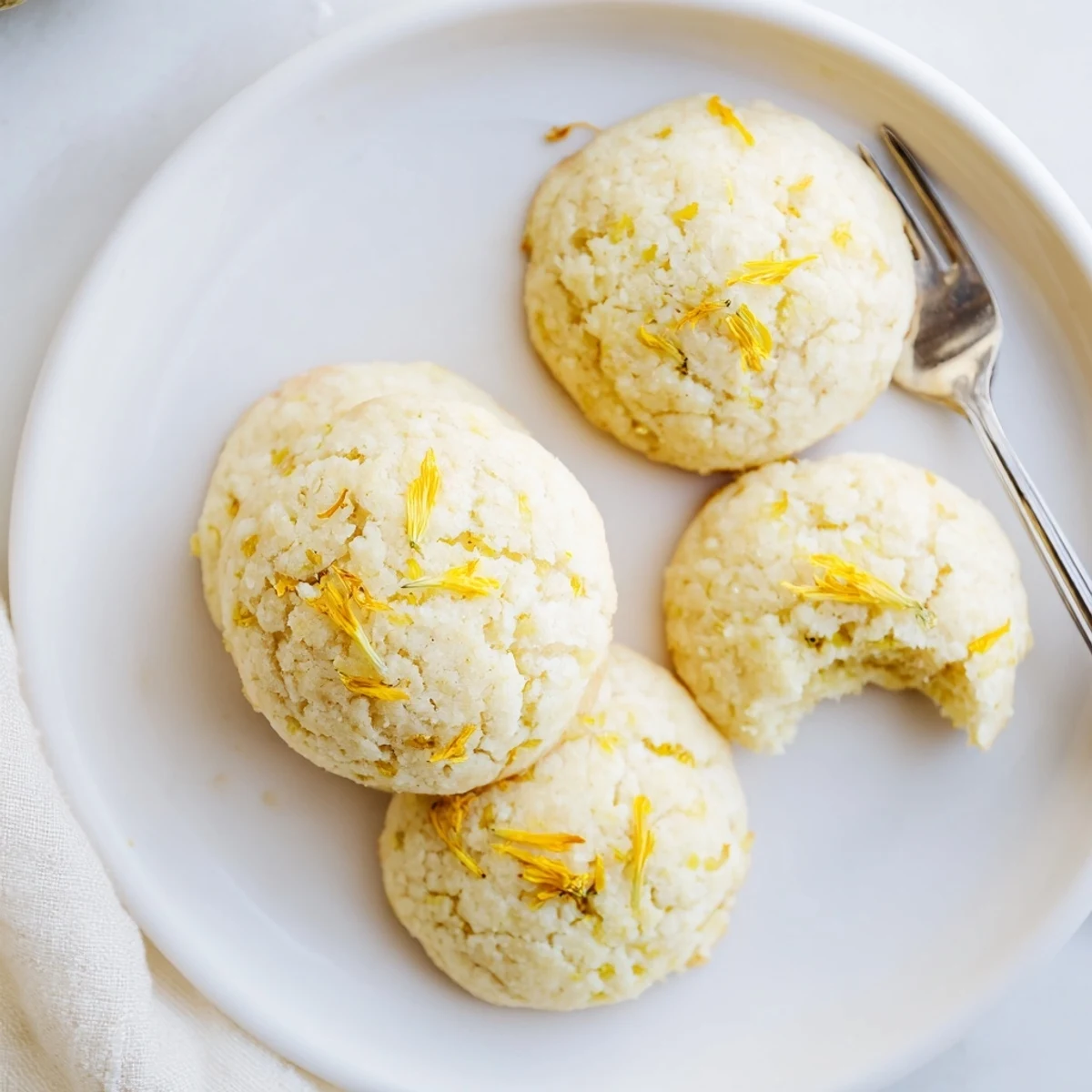Tea time table with Magical Dandelion Cookies Recipe next to chamomile tea