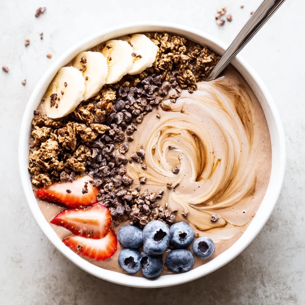 Creamy Coffee Protein Smoothie Bowl Recipe topped with crunchy granola and berries  