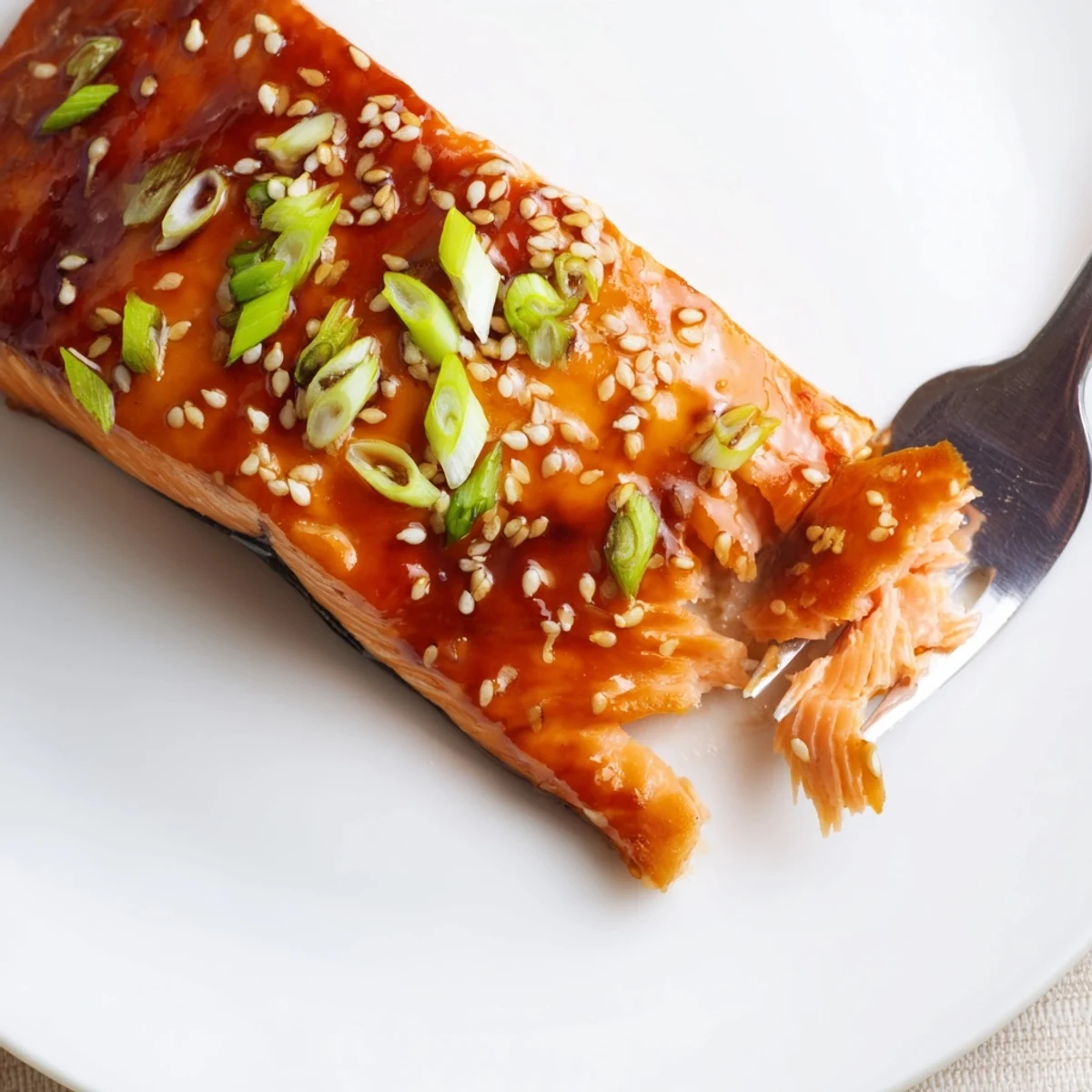 Gluten Free Teriyaki Salmon Recipe brushed with glossy teriyaki glaze, sesame sprinkled