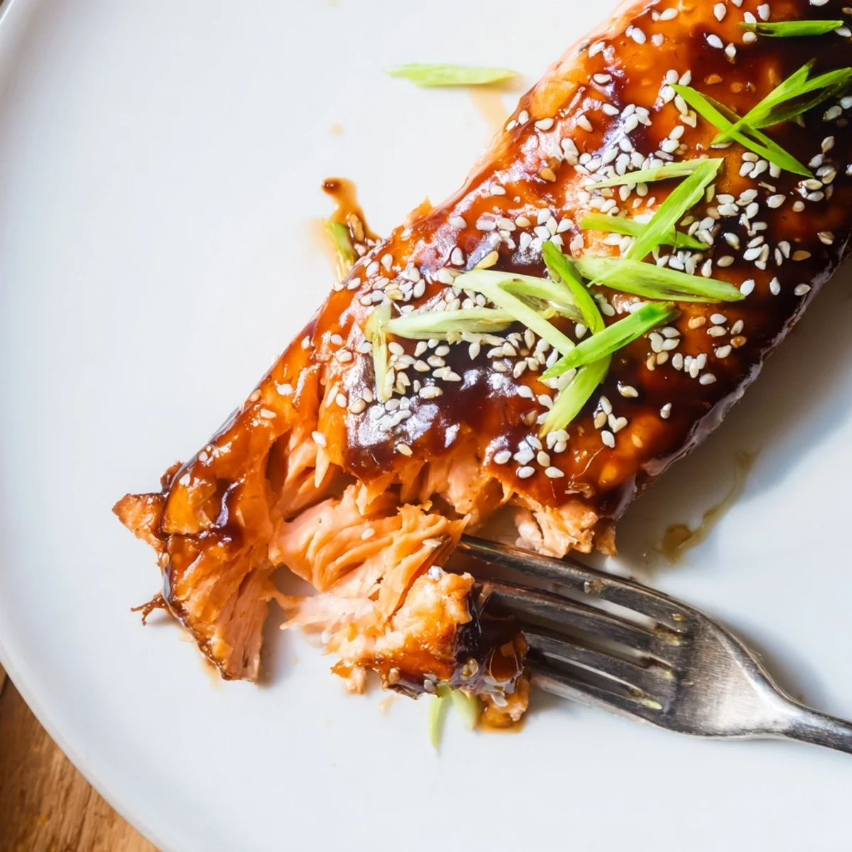 Gluten Free Teriyaki Salmon Recipe served over steamed rice with scallion garnish